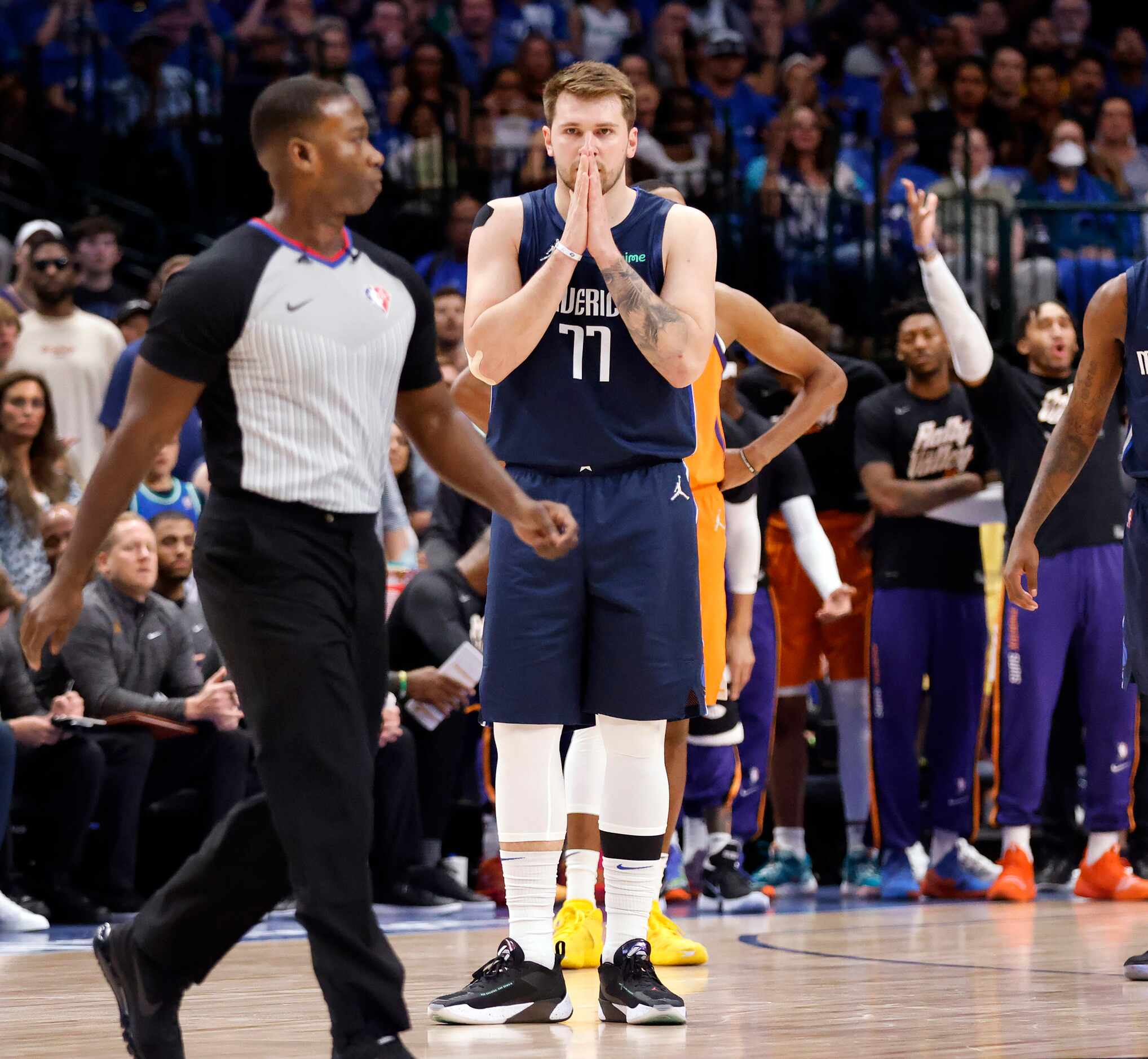 Dallas Mavericks guard Luka Doncic (77) reacts after he was given a first quarter technical...