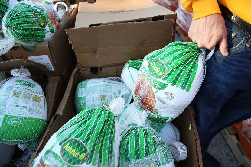 Turkeys are distributed by a food bank in this file photo. The AT&T Foundation has donated...