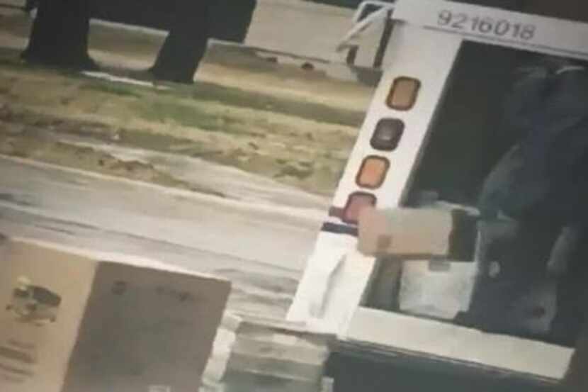 A Fort Worth woman captured cellphone footage of a postal worker tossing packages into rainy...