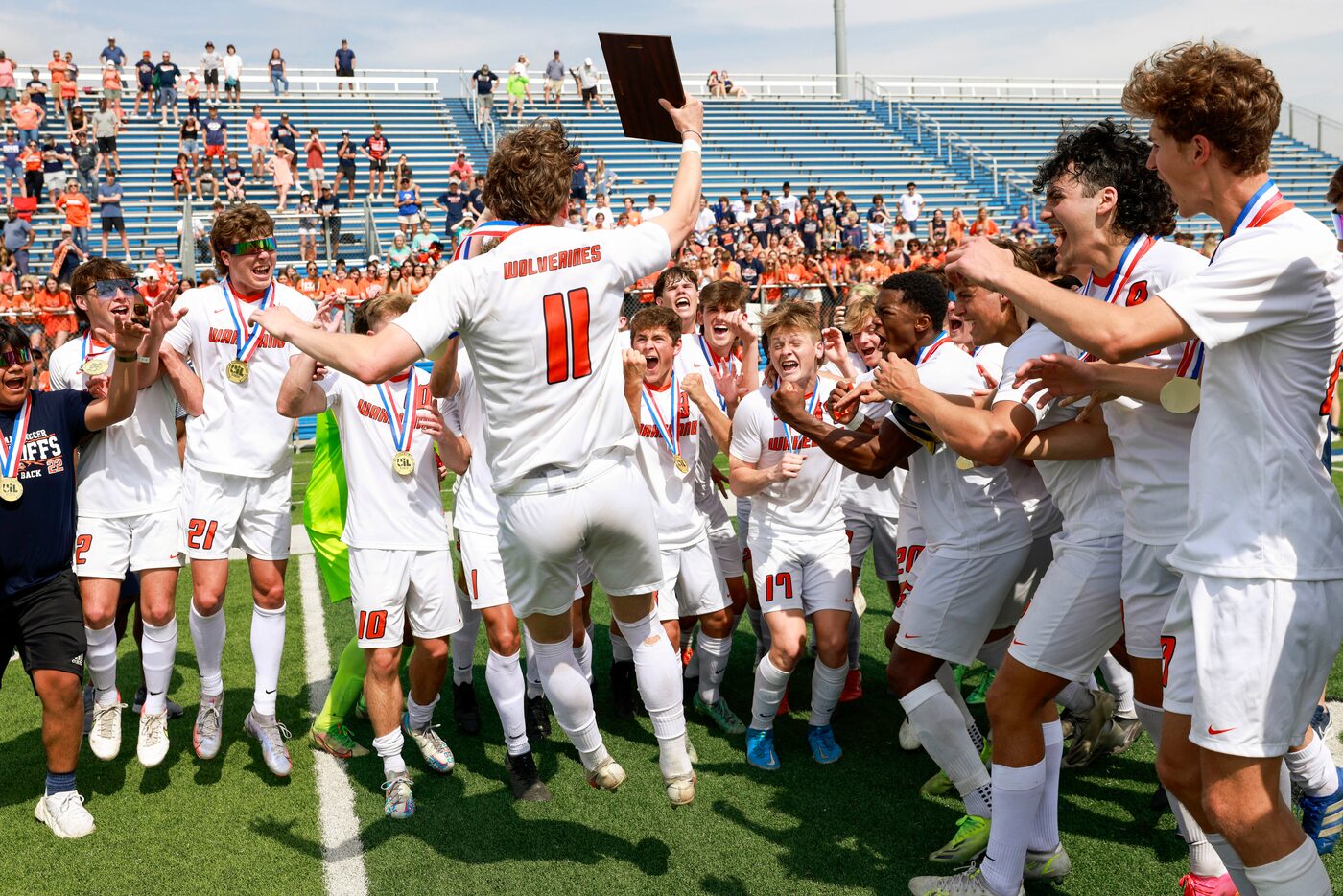 Frisco Wakeland forward William Heidman (11) celebrates with his teammates after being named...