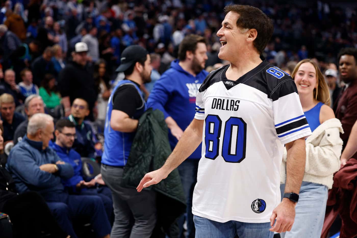 Dallas Mavericks minority stakeholder Mark Cuban talks with fans during the second half of...