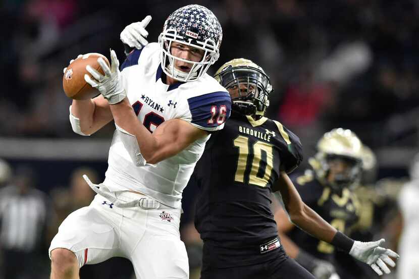 Denton Ryan-Birdville game.
Ryan wide receiver Drew Sanders (16) catches a pass, while being...