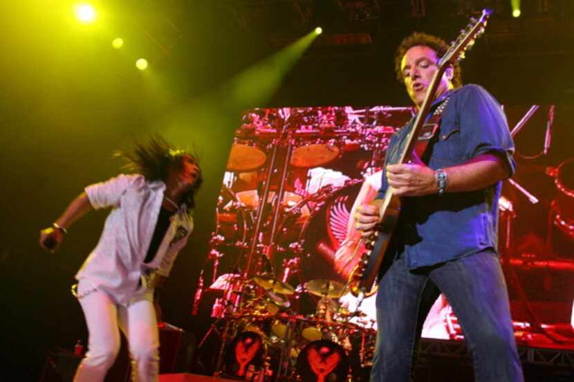 Neal Schon on lead guitar and new singer, Arnel Pineda, rock Dallas with Journey in concert...