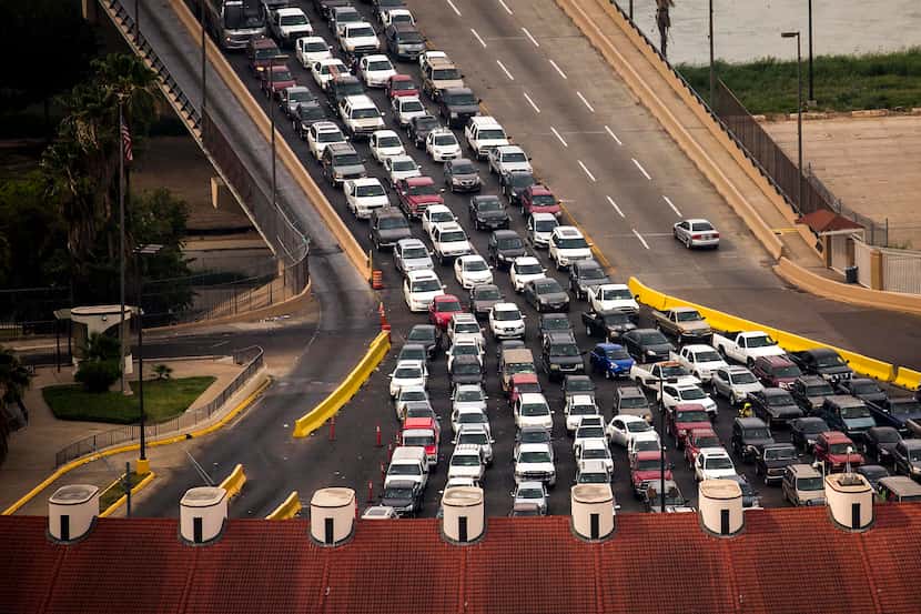 Vehicles wait on the Juarez-Lincoln International Bridge to enter the United States from...
