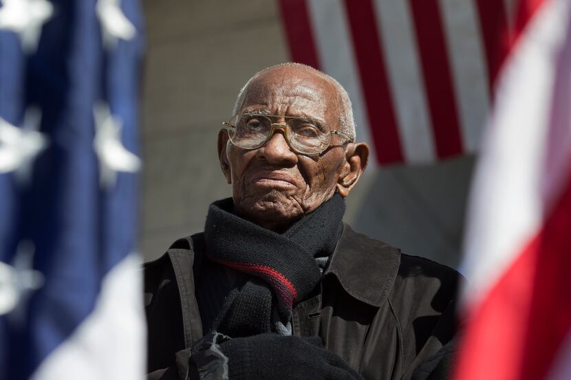 Richard Overton the oldest living WWII veteran, listens during a Veterans Day ceremony...