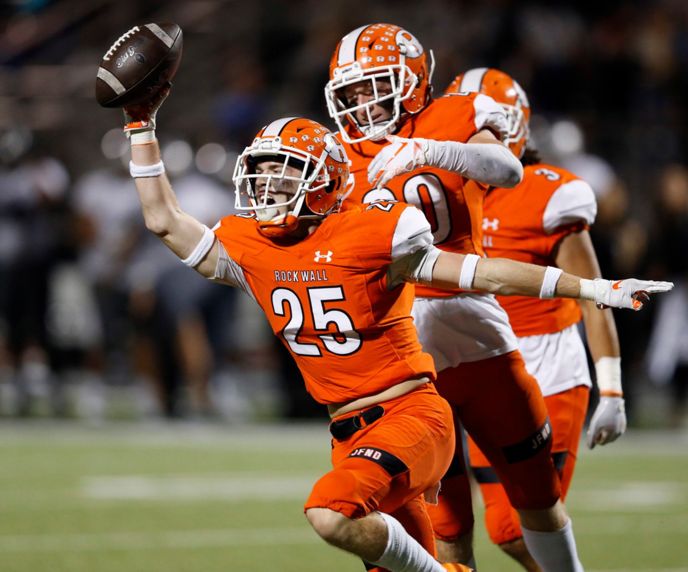 Rockwall's Corey Kelley (25) celebrates after intercepting a pass intended for  Arlington...