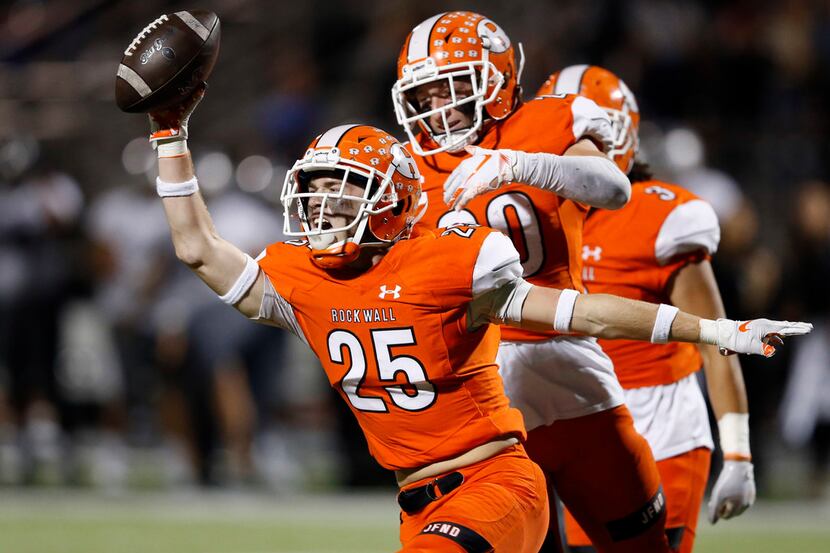 Rockwall's Corey Kelley (25) celebrates after intercepting a pass intended for  Arlington...