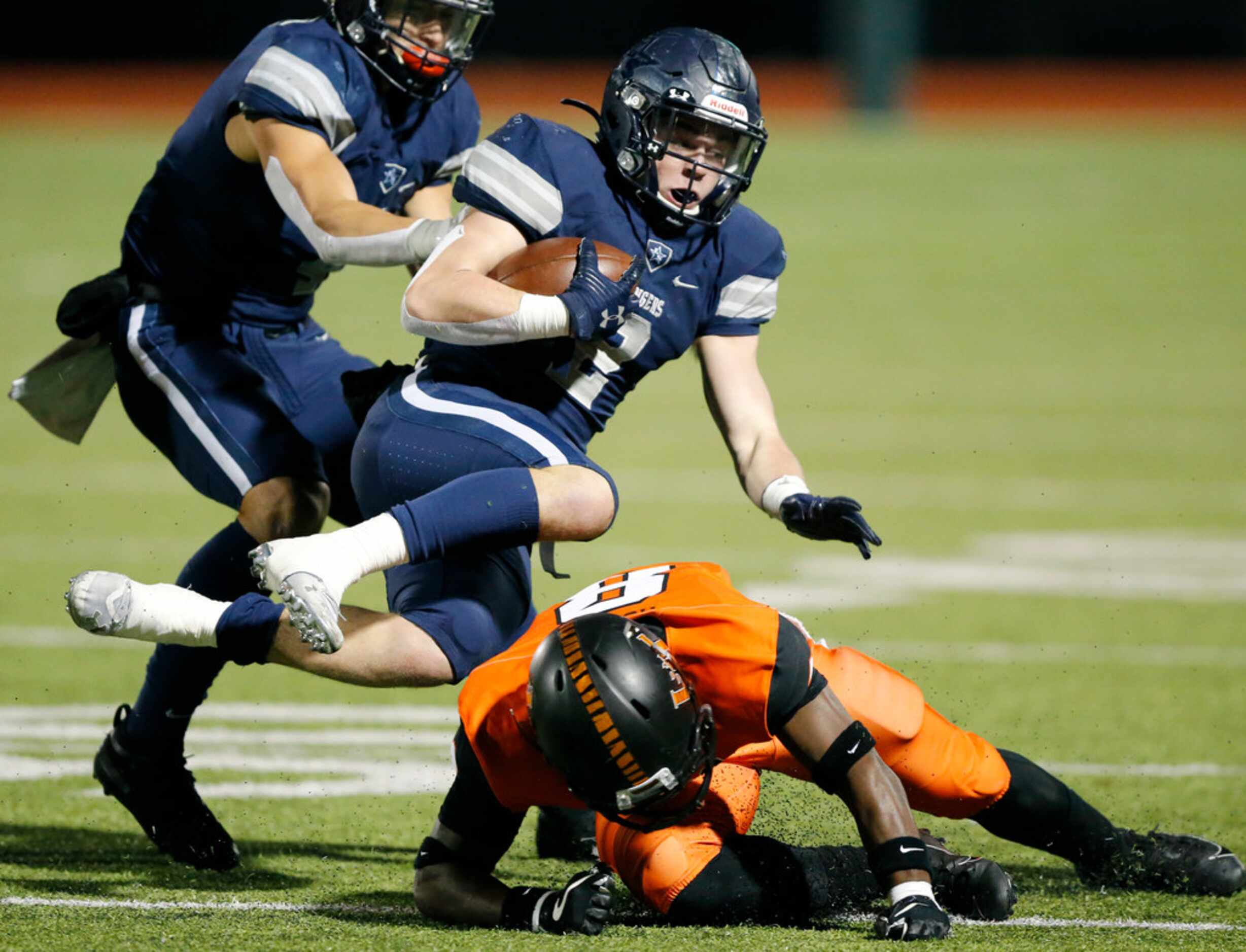 Frisco Lone Star wide receiver Jake Bogdon (2) has his feet taken out from underneath him by...