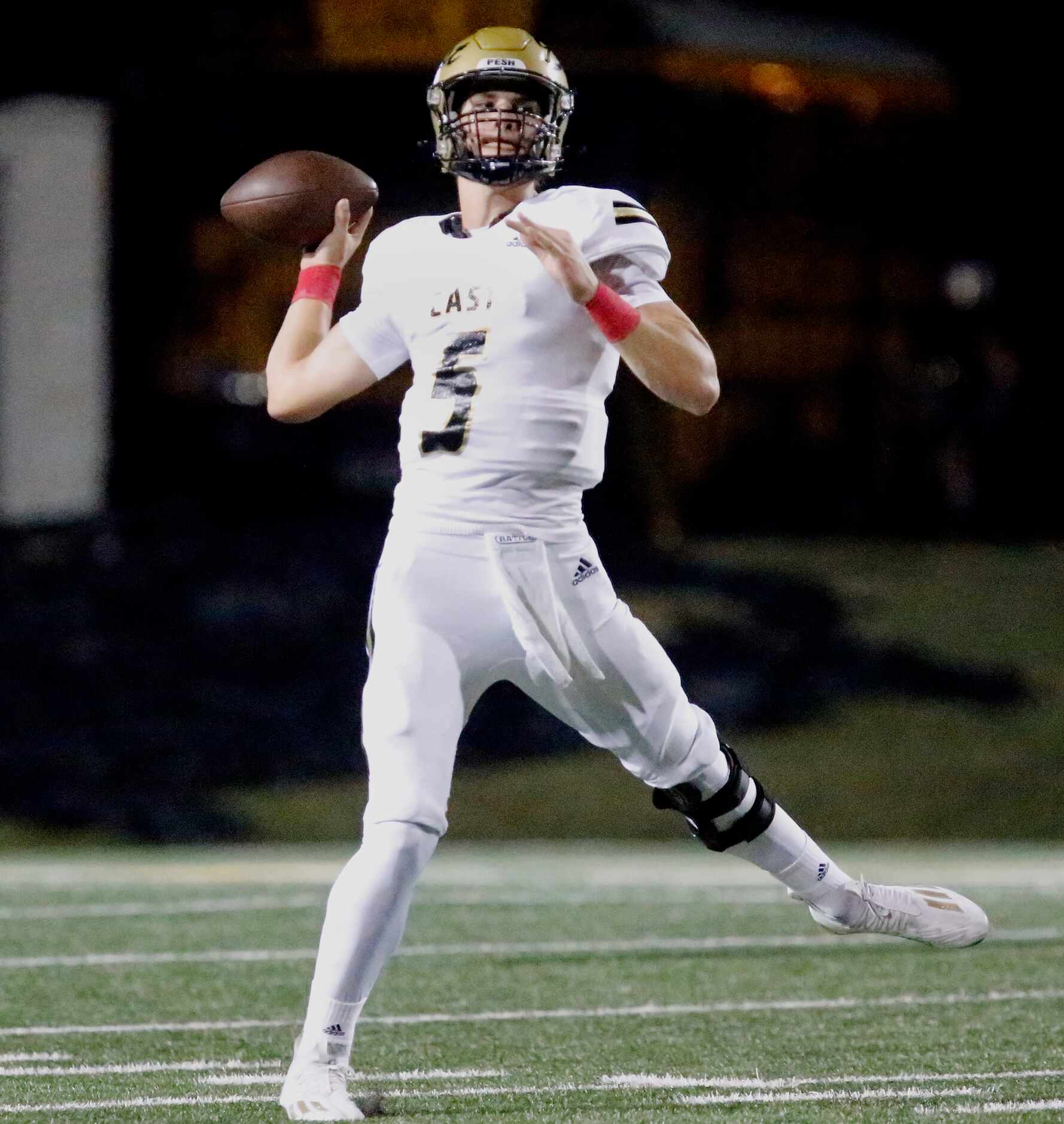 Plano East High School quarterback Drew Devillier (5) throws a pass during the first half as...