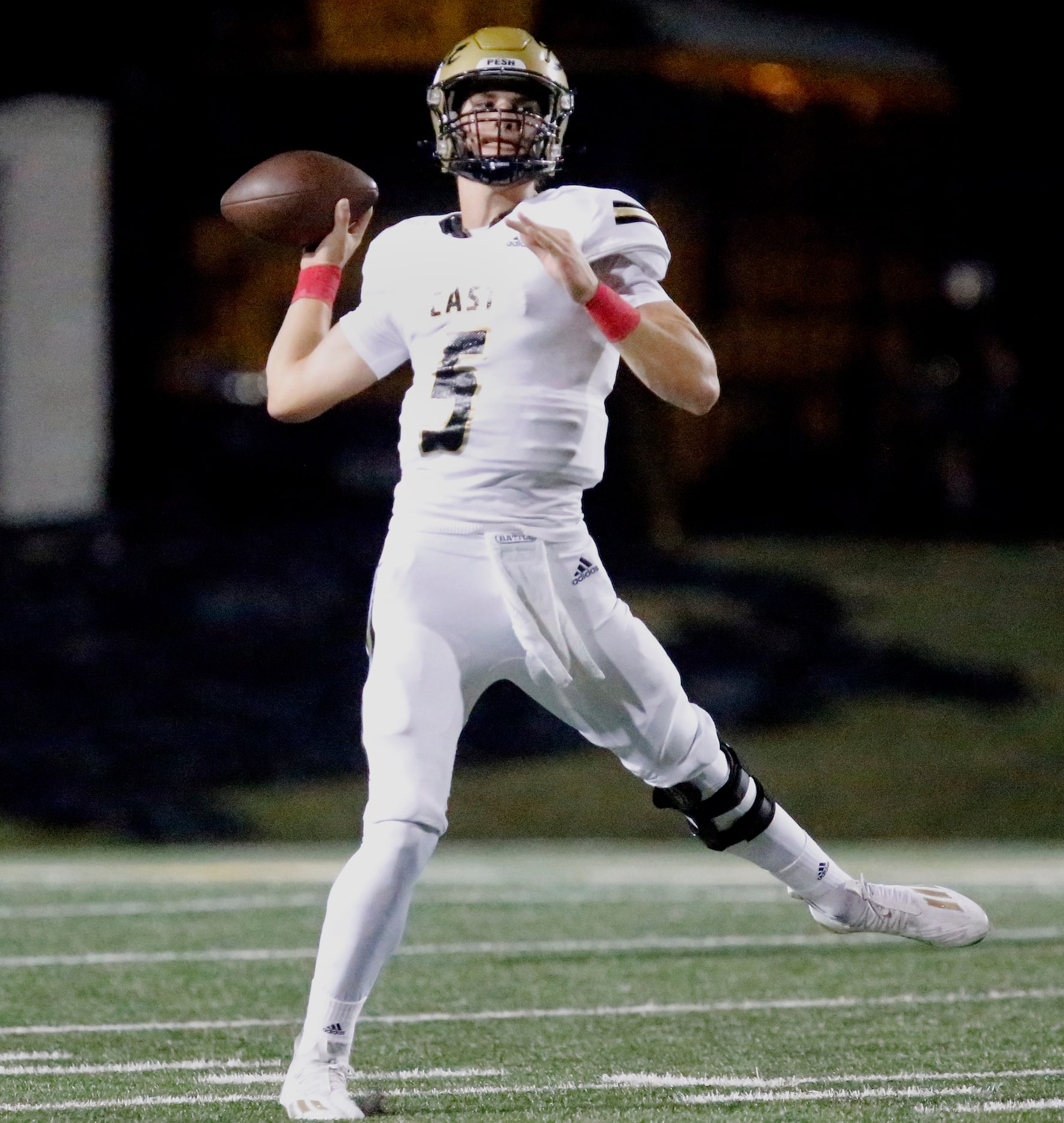 Plano East High School quarterback Drew Devillier (5) throws a pass during the first half as...