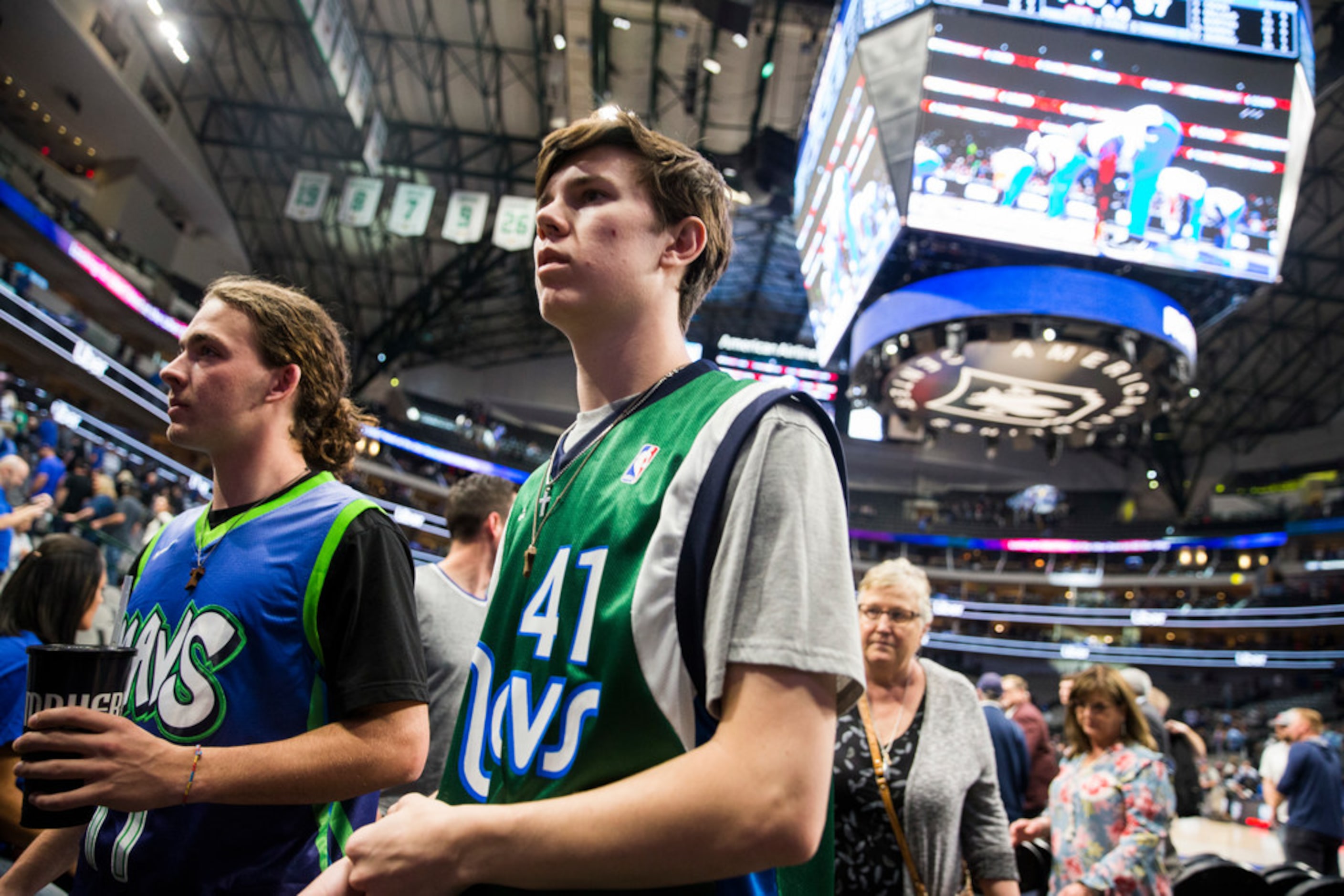 Dallas Mavericks fans leave the court after the Dallas Mavericks beat the Denver Nuggets...