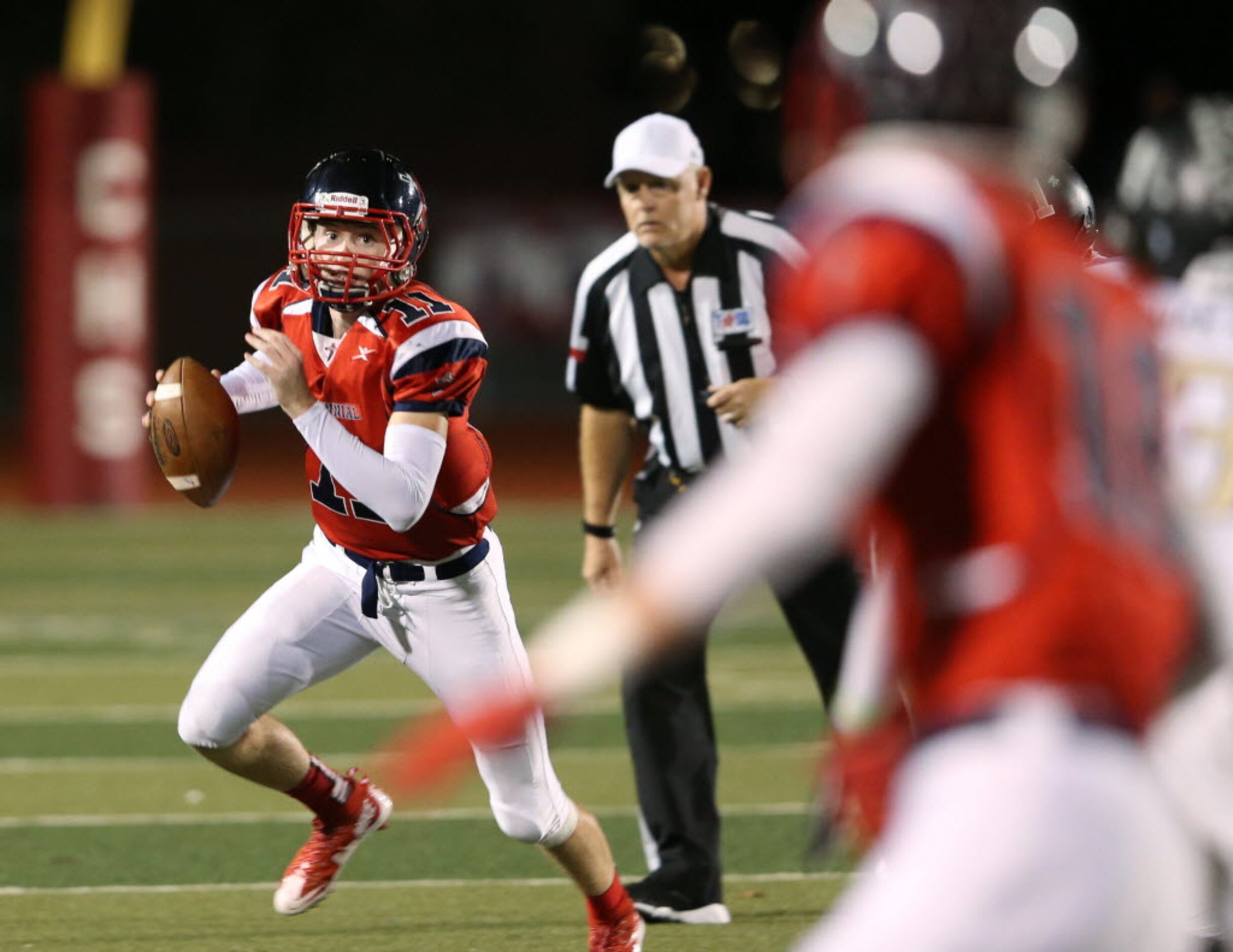 Frisco Centennial's Court Walker (11) looks for an open teammate to throw to in a game...