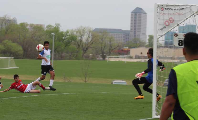 FC Dallas U14 player Victor Fimbres watches as his volleyed effort goes in for FC Dallas'...