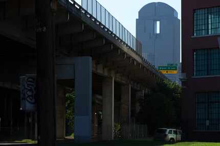 Interstate 345 divides Deep Ellum (right) and downtown Dallas (left) as the Chase Tower...