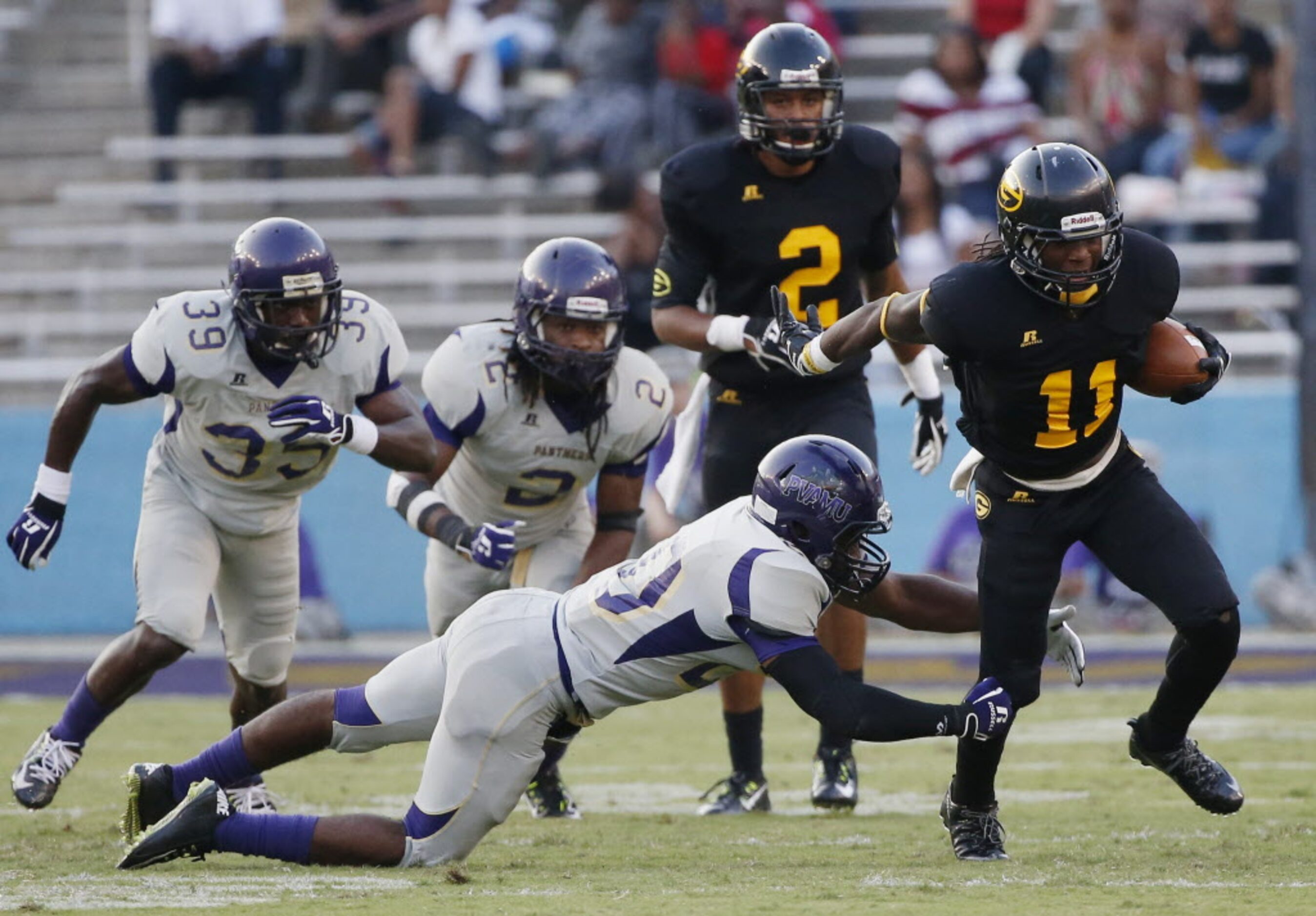 Grambling State wide receiver Ka'Jandre Domino (11) attempts to break a tackle after a catch...