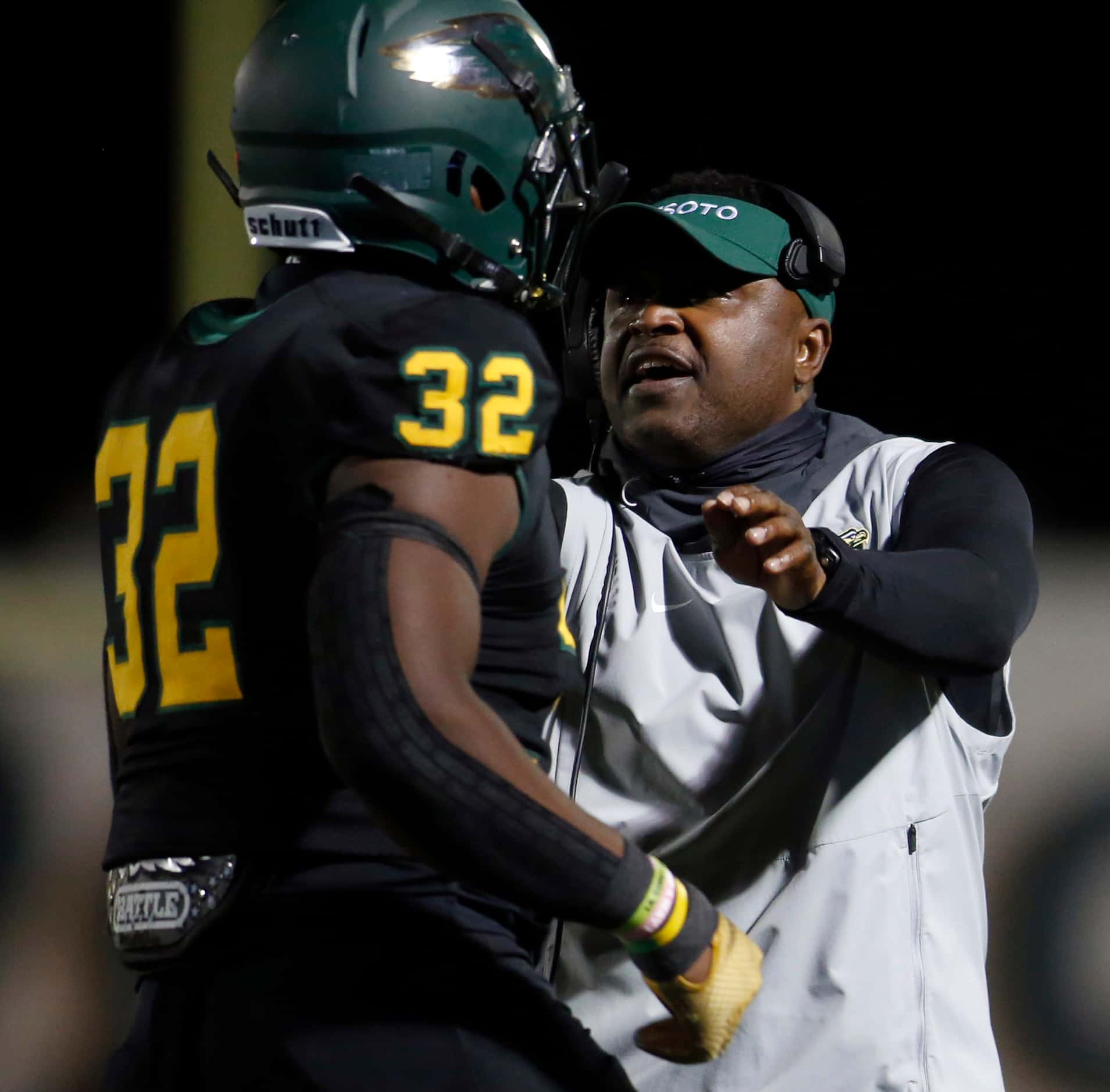 DeSoto head coach Claude Mathis welcomes defensive lineman Shemar Turner (32) to the team...