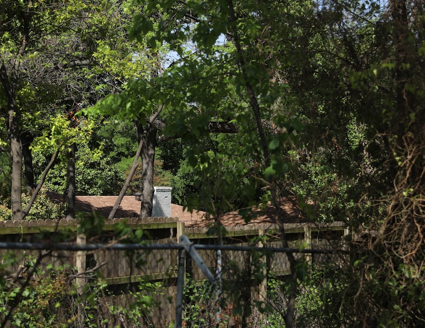 A back parking lot at Shoreline City Church opens up to a greenspace bordered by homes and...