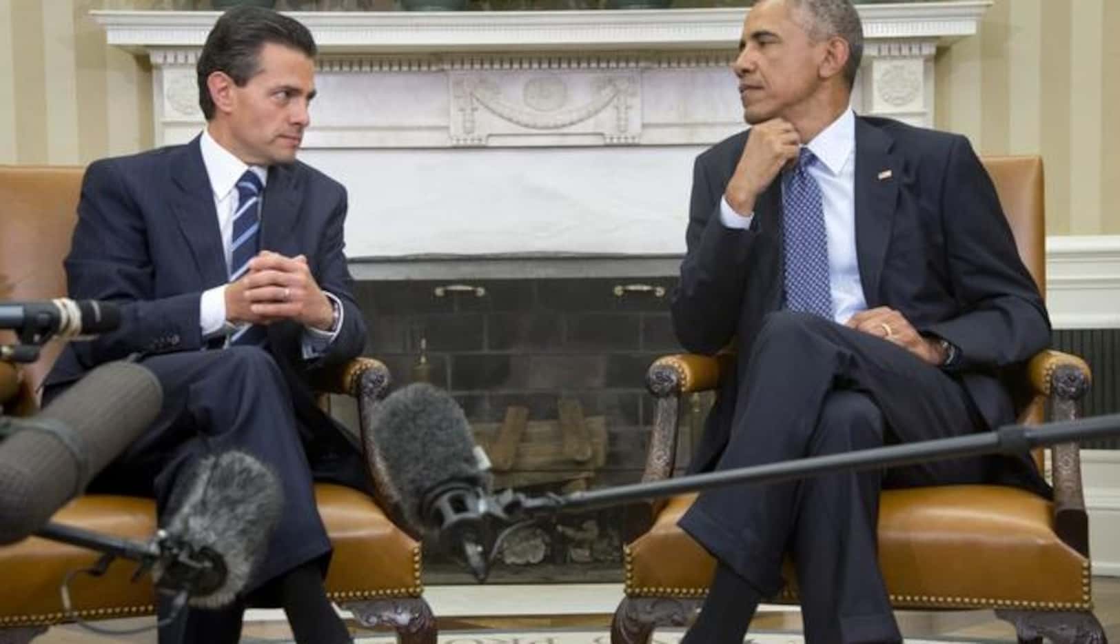 Los presidentes Barack Obama (der.) y Enrique Peña Niego durante la reunión del martes en la...
