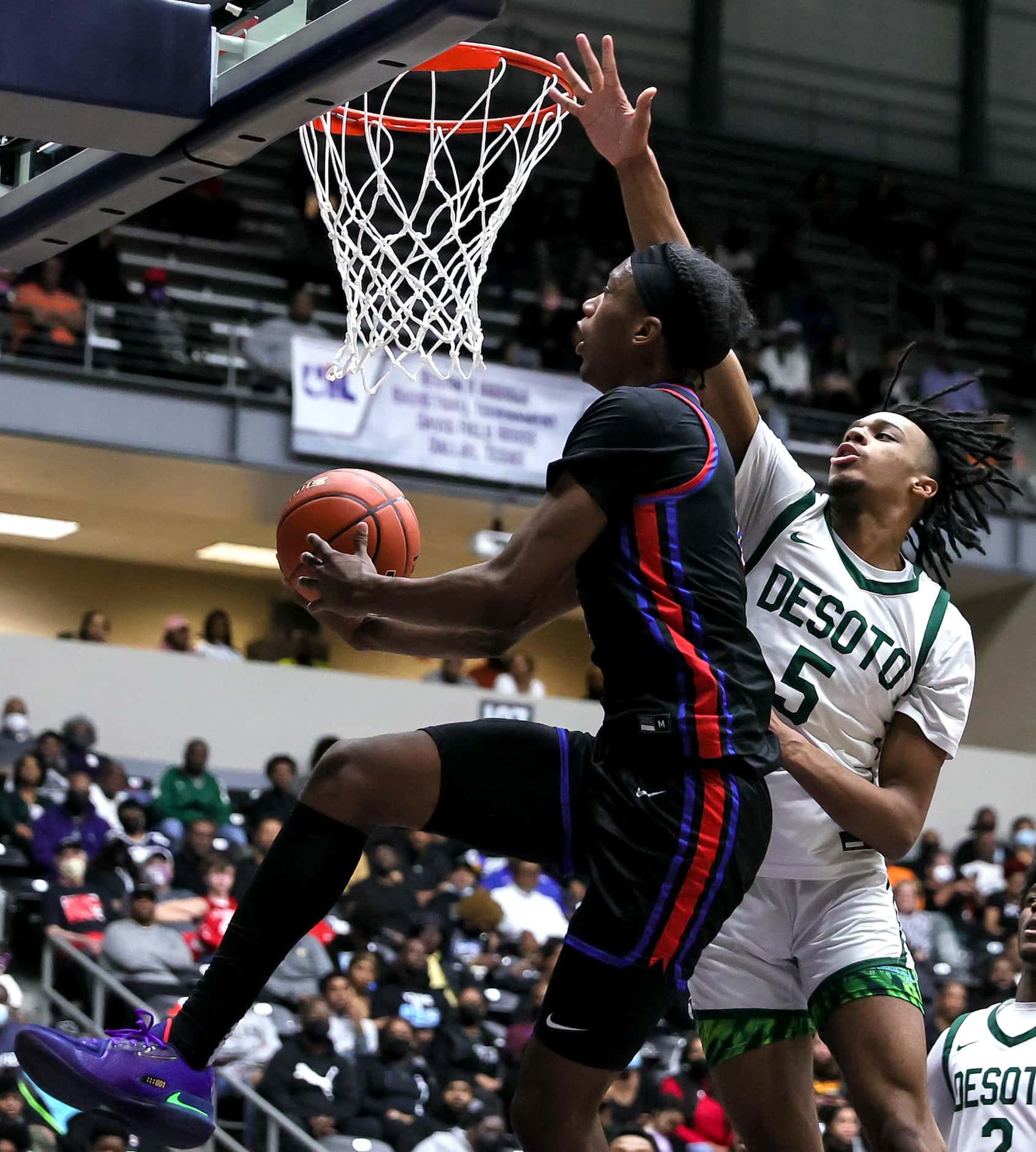 Duncanville forward Ron Holland goes strong to the basket against DeSoto forward Ahmir Wall...