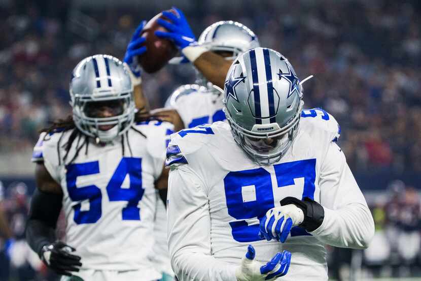 Dallas Cowboys defensive end Taco Charlton (97) celebrates after recovering a fumble after...