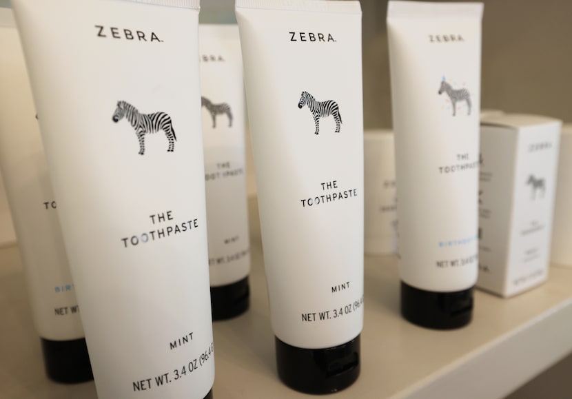 Jenn Thatcher organizes products from her clean brand, ZEBRA, at her home office in Argyle,...