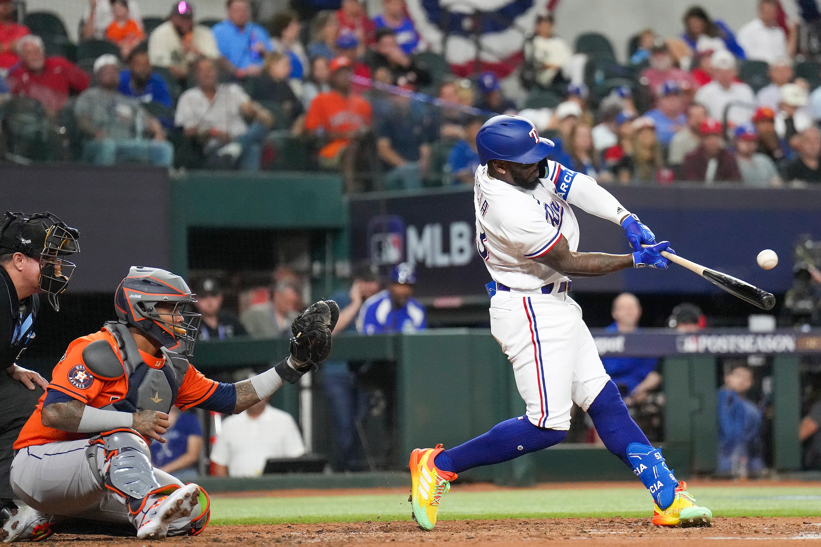 Texas Rangers right fielder Adolis Garcia hits a solo home run during the second inning...