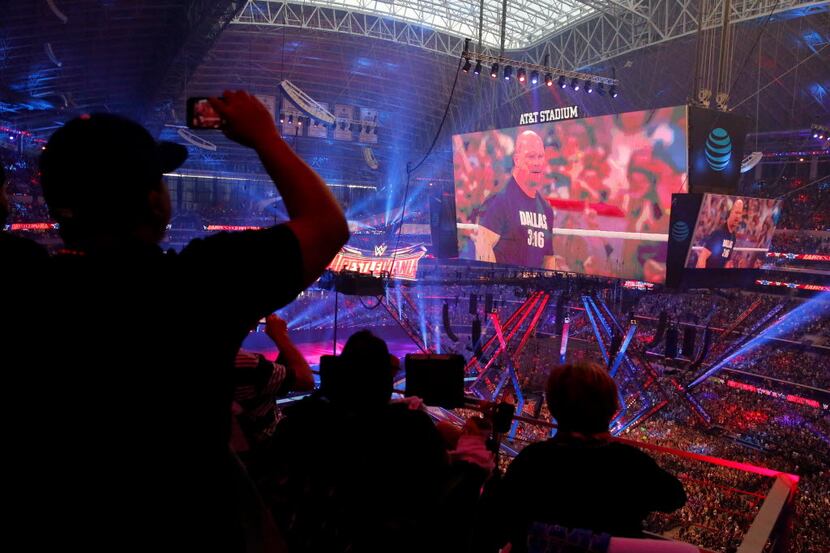 Fans cheer on "Stone Cold" Steve Austin at WrestleMania 32 at AT&T Stadium in Arlington, TX,...