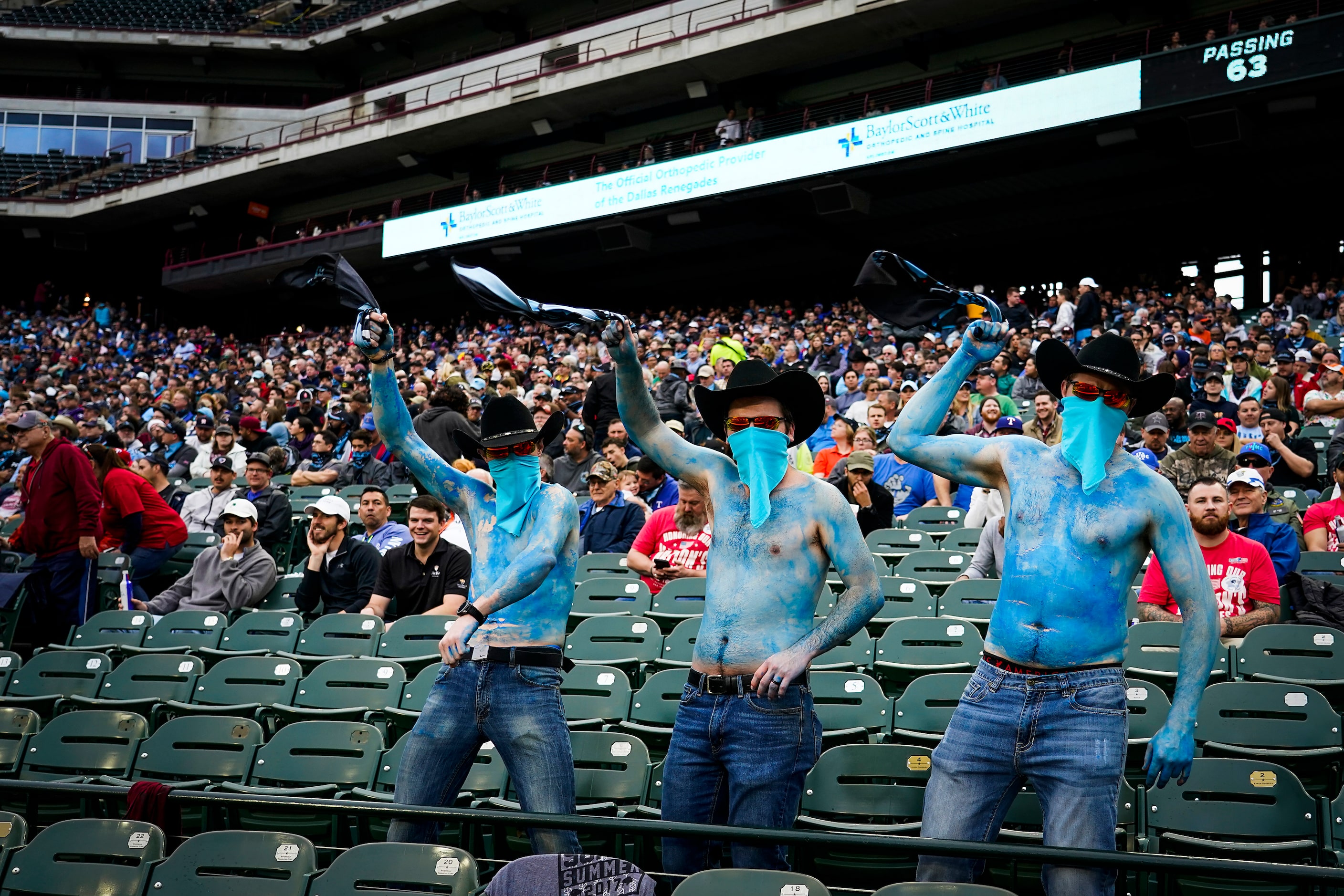 Dallas Renegades fans cheer their team during the first half of an XFL football game against...