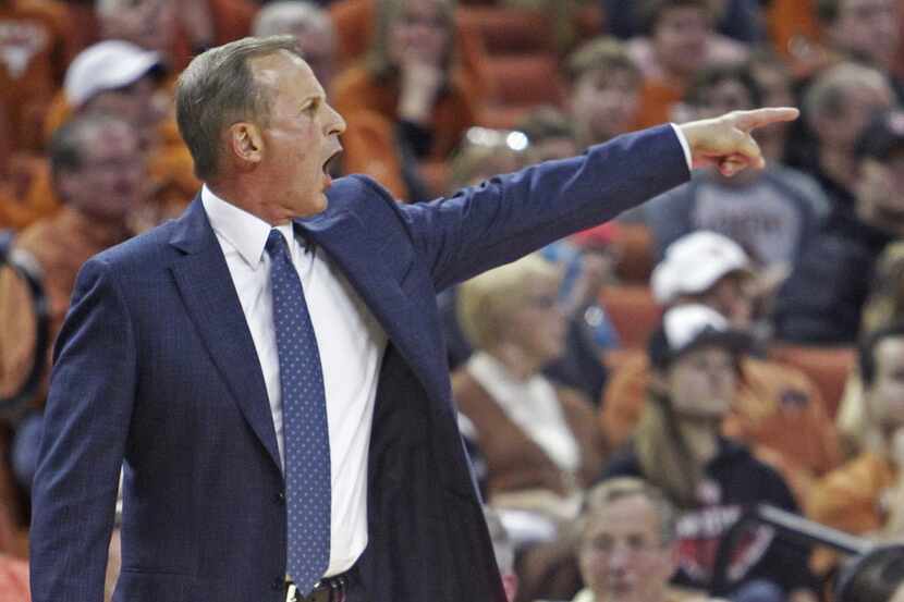 Texas coach Rick Barnes calls out to his team during the second half of an NCAA college...