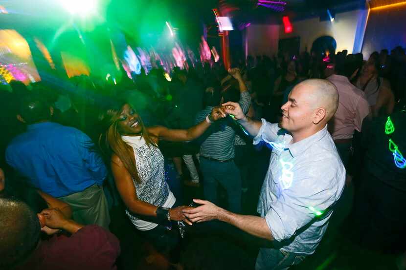 People dance during a salsa night at Gloria's in Addison, Texas on Jan. 27, 2018. (Nathan...