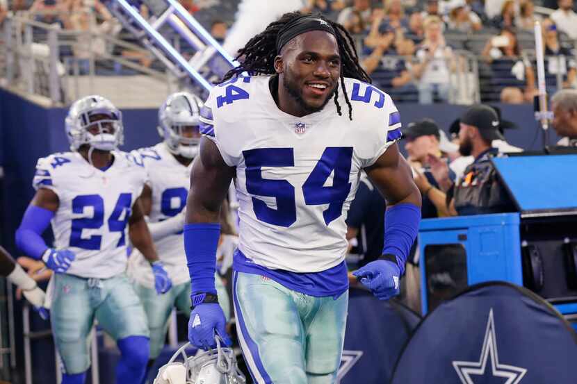 FILE - In this Aug. 18, 2018, file photo, Dallas Cowboys linebacker Jaylon Smith (54) runs...