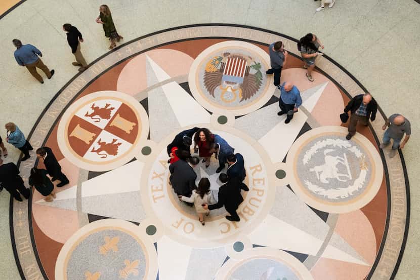 People gather in the Texas State Capitol Rotunda in Austin, Texas, on opening day of the...