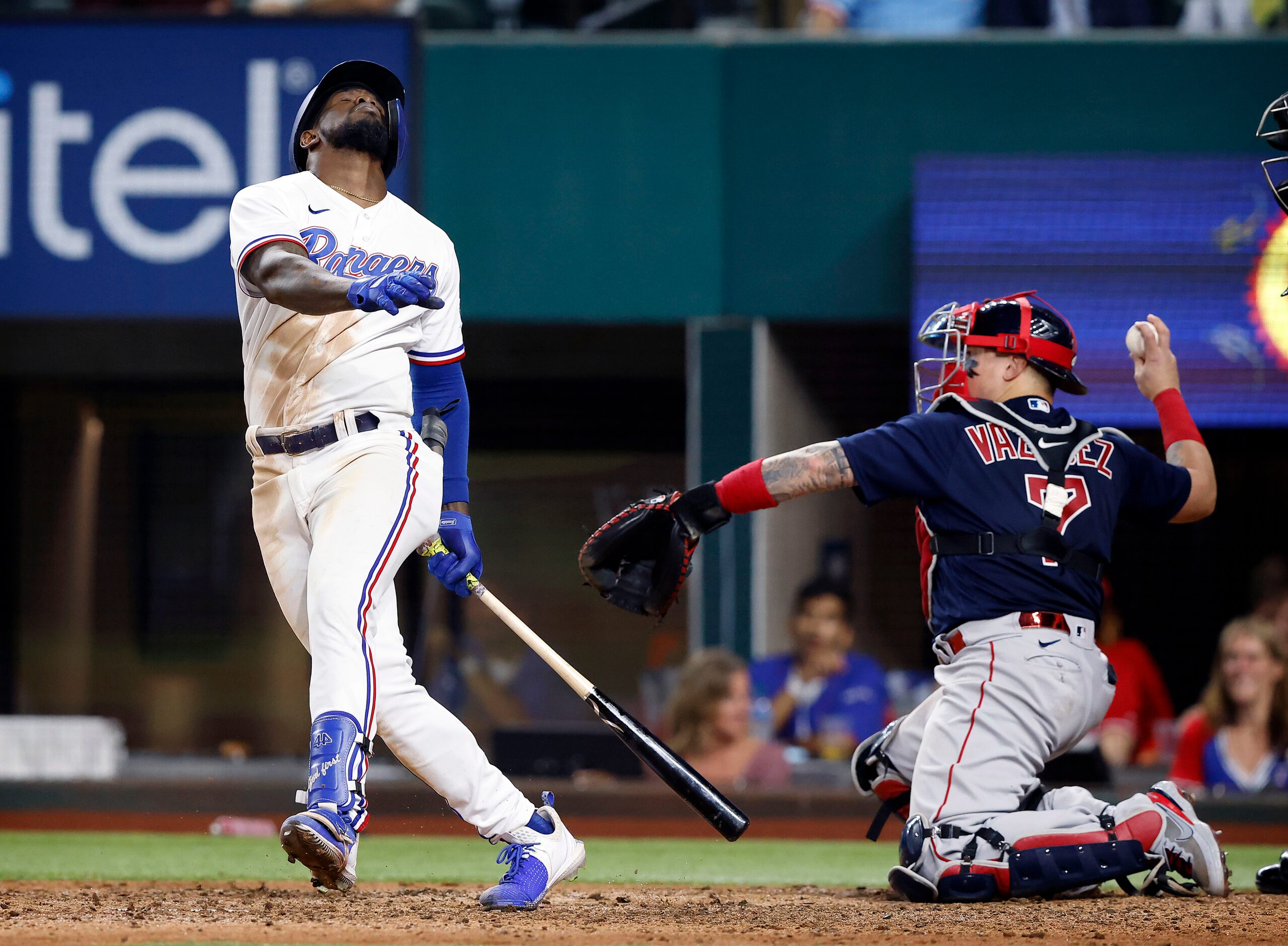 Texas Rangers right fielder Adolis Garcia (53) reacts as he strikes out against Boston Red...