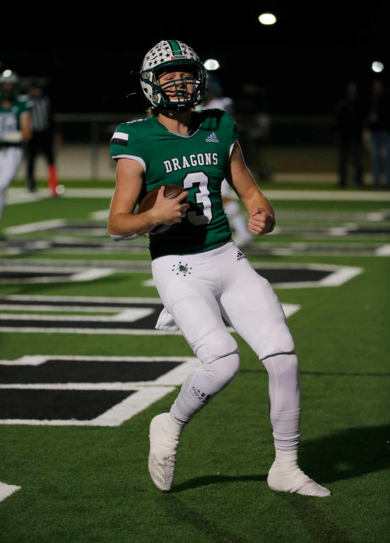 Southlake Carroll quarterback Quinn Ewers (3) scores a touchdown against Eaton during the...