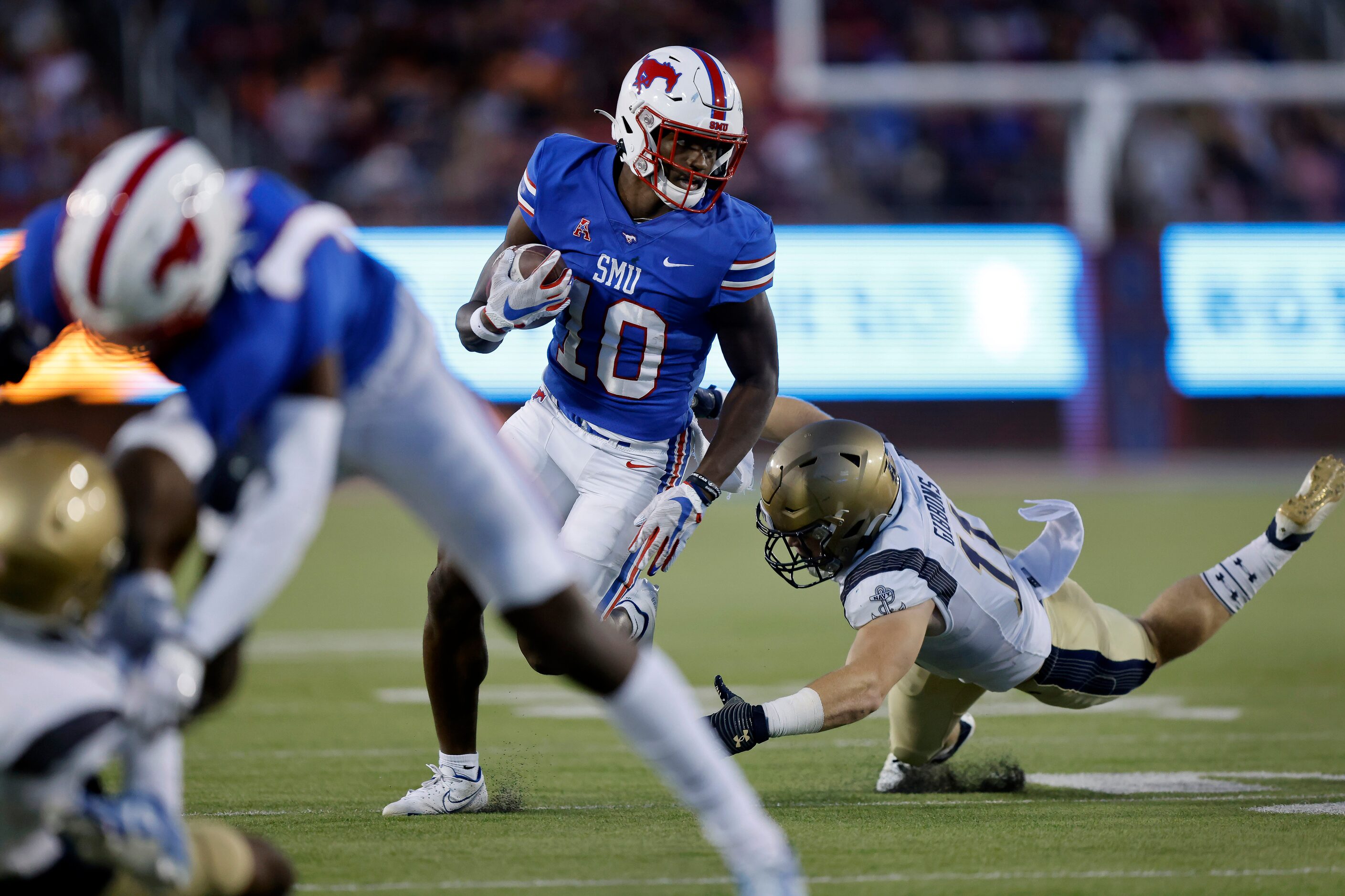 Southern Methodist Mustangs wide receiver Dylan Goffney (10) eludes Navy Midshipmen...