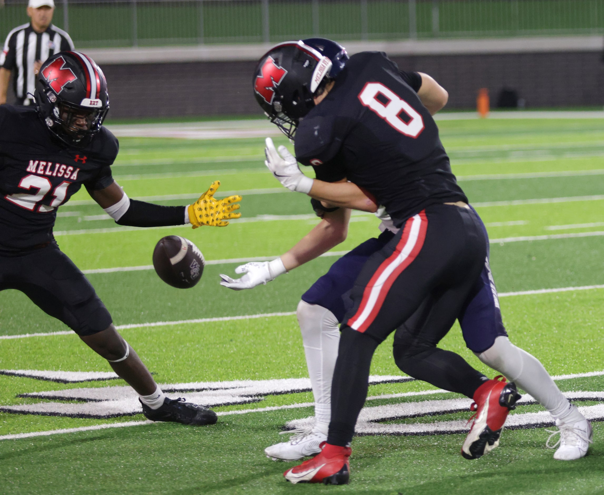 Melissa players cause a fumble during the Prosper Walnut Grove High School at Melissa High...