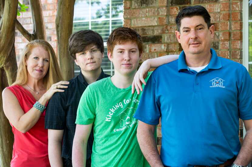 Jason Dyke and wife April at their Coppell home with their sons Ryan (left), a 16-year-old...