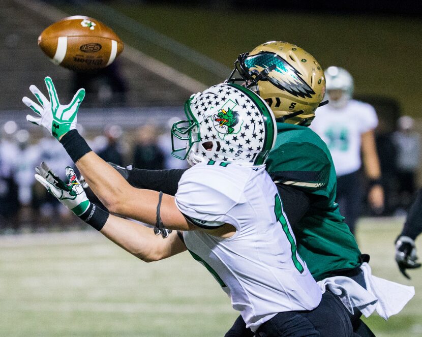 Southlake Carroll wide receiver Jackson Davis (11) reaches to catch a pass with DeSoto...