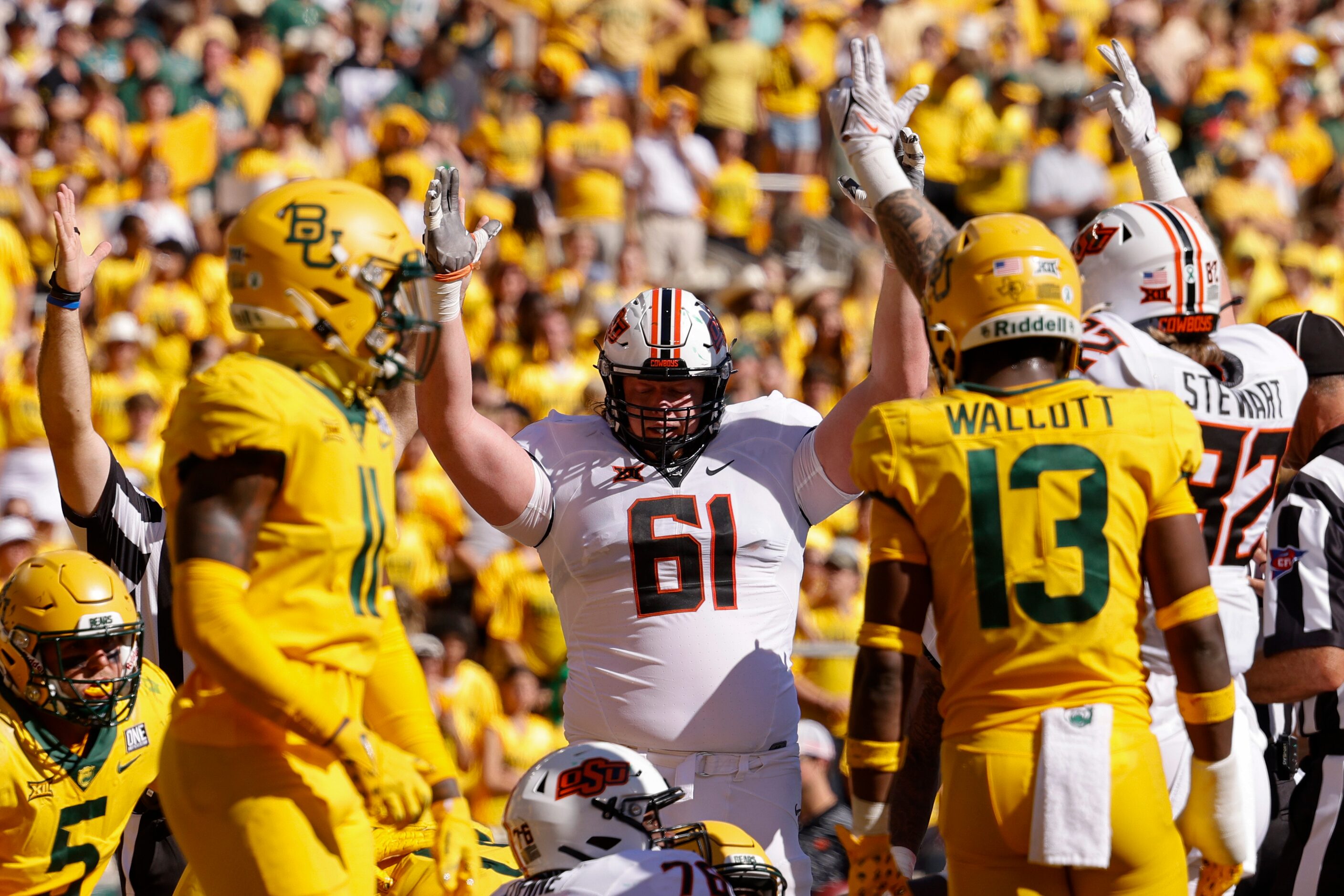 Oklahoma State offensive lineman Jake Springfield (61) celebrates a touchdown by quarterback...