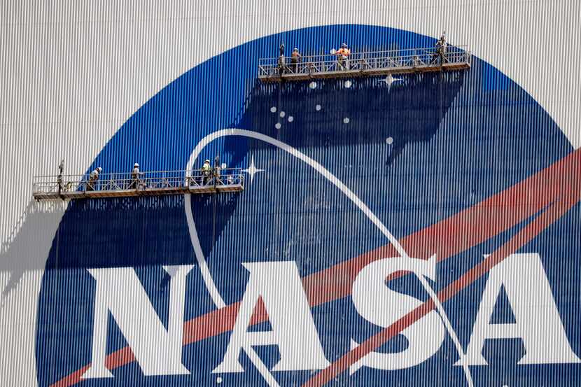 A 2020 file photo of crews working on the Vehicle Assembly Building at NASA's Kennedy Space...