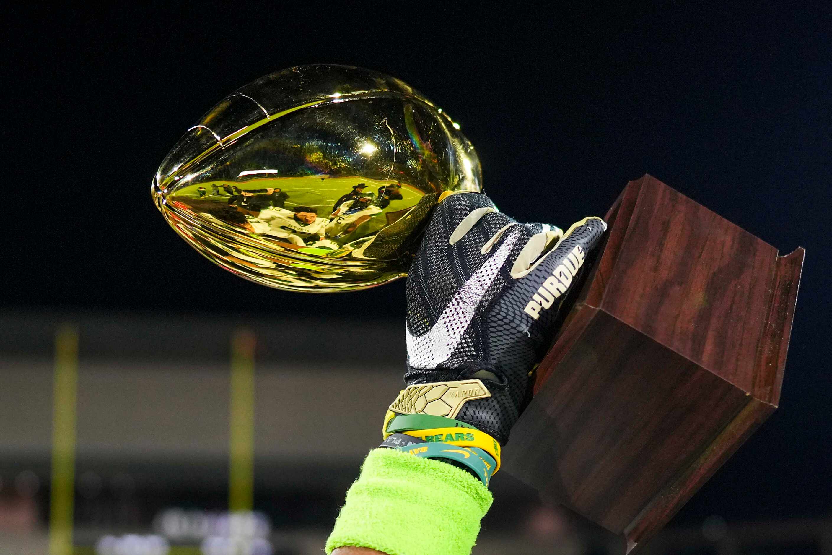 DeSoto players celebrate with the Class 6A Division II Region II championship trophy after a...
