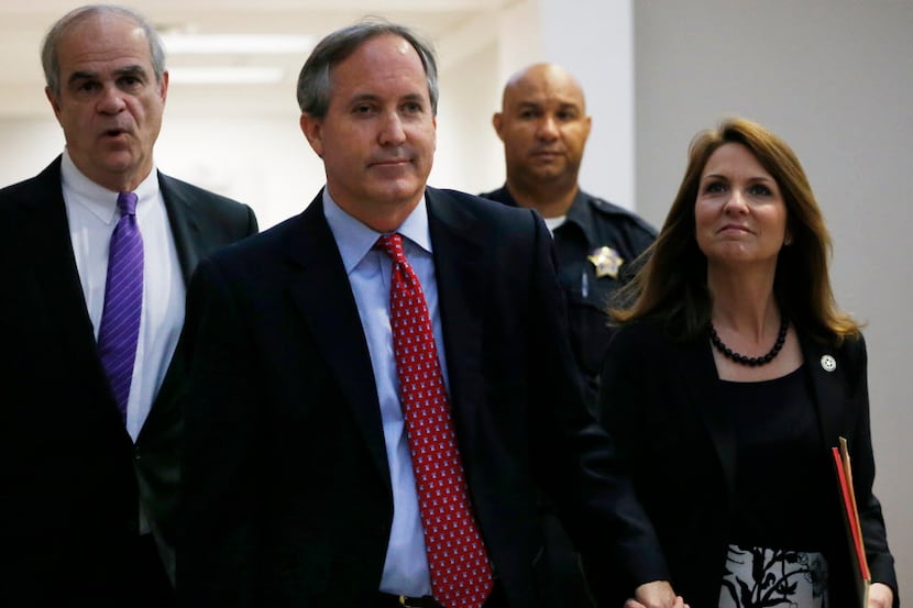  Texas Attorney General Ken Paxton and his wife, Angela, entered a Dallas courtroom in May...