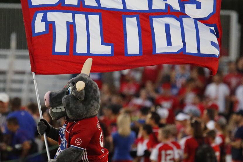 The FC Dallas mascot waves the team flag before the start of their contest as FC Dallas...