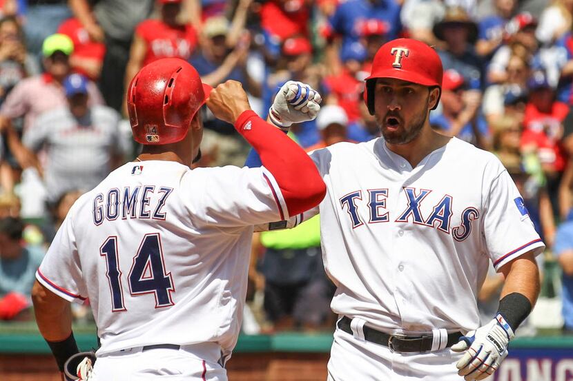 Texas Rangers' Carlos Gomez (14) celebrates the three-run home run by Joey Gallo against the...
