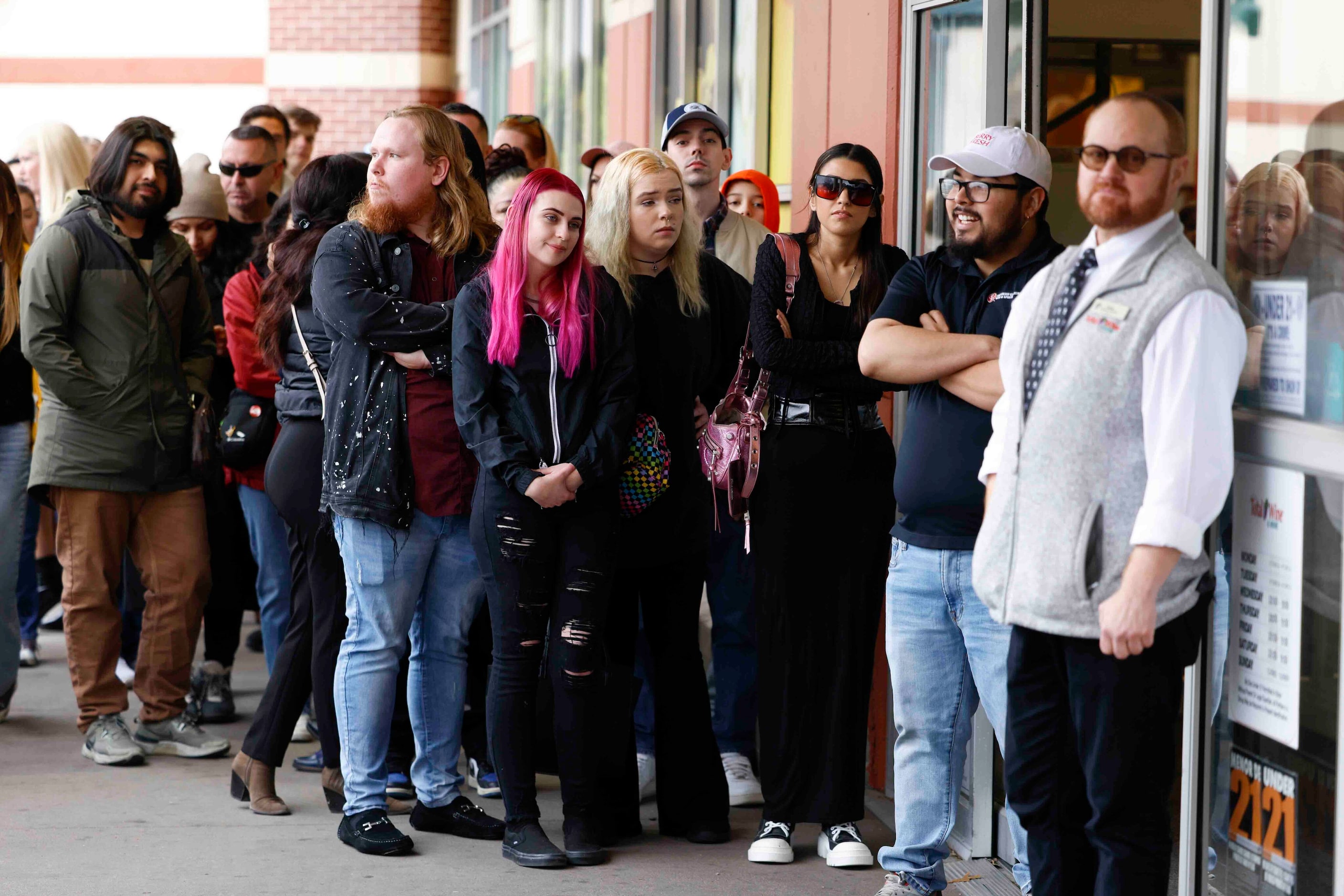 Hundreds of people wait in line to get a glimpse of actors Bryan Cranston and Aaron Paul...