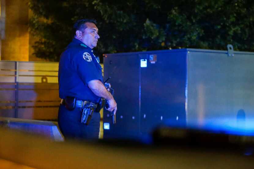 Dallas Police Deputy Chief Israel Herrera looks to a fellow officer during a felony traffic...