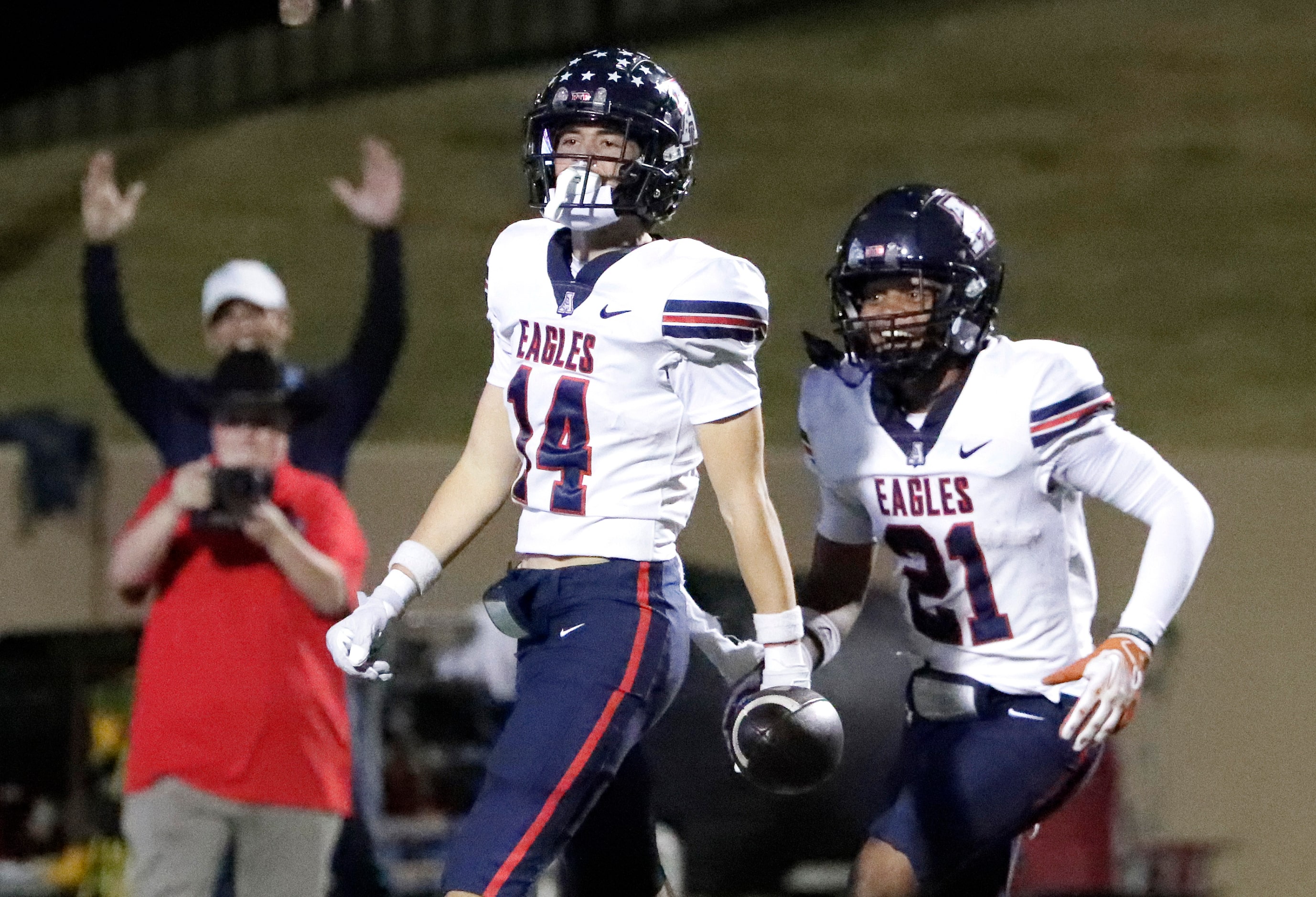 Allen High School wide receiver Carter Harris (14) celebrates with Allen High School running...