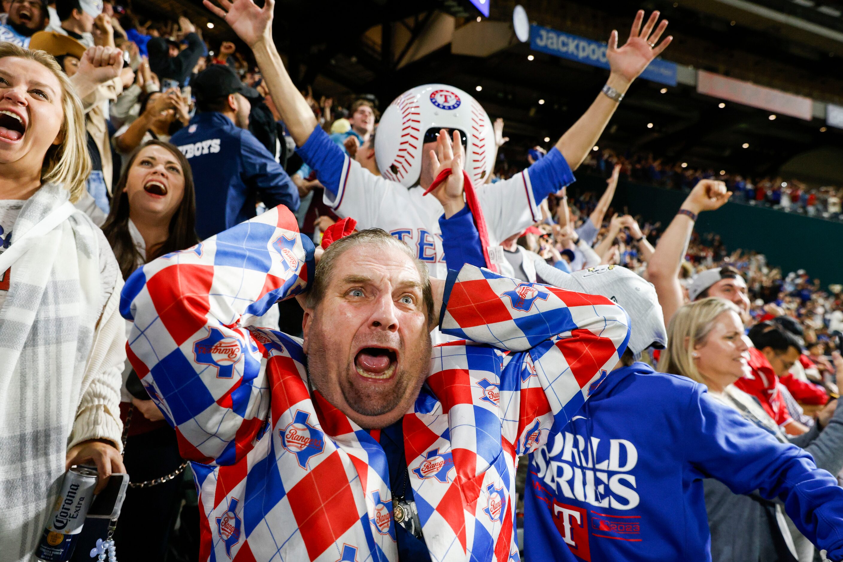 Texas Rangers fan from 1972, Terry Cox, (center) from Tyler, TX, including other, cheer...