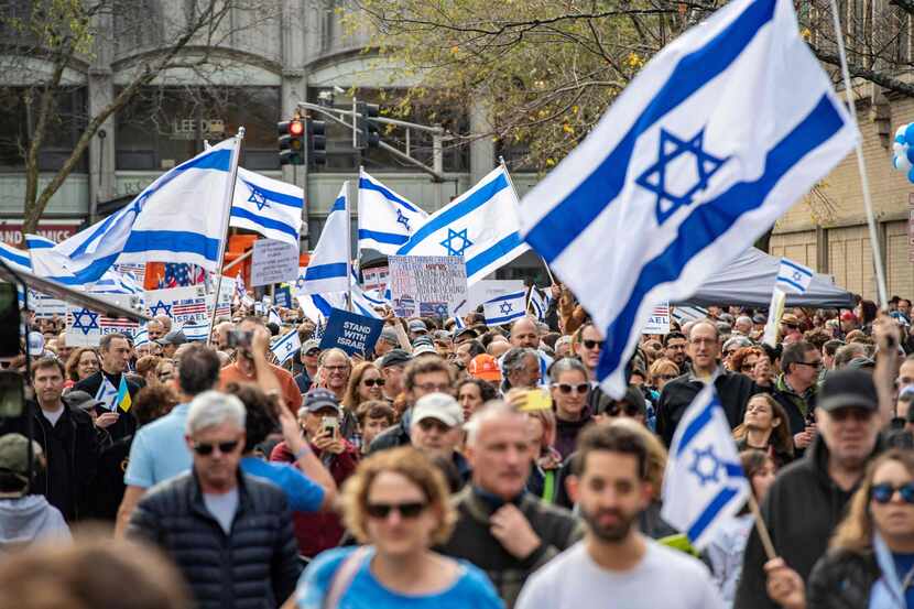 Marchers show support for Israel's right to exist and defend itself in the war against Hamas...