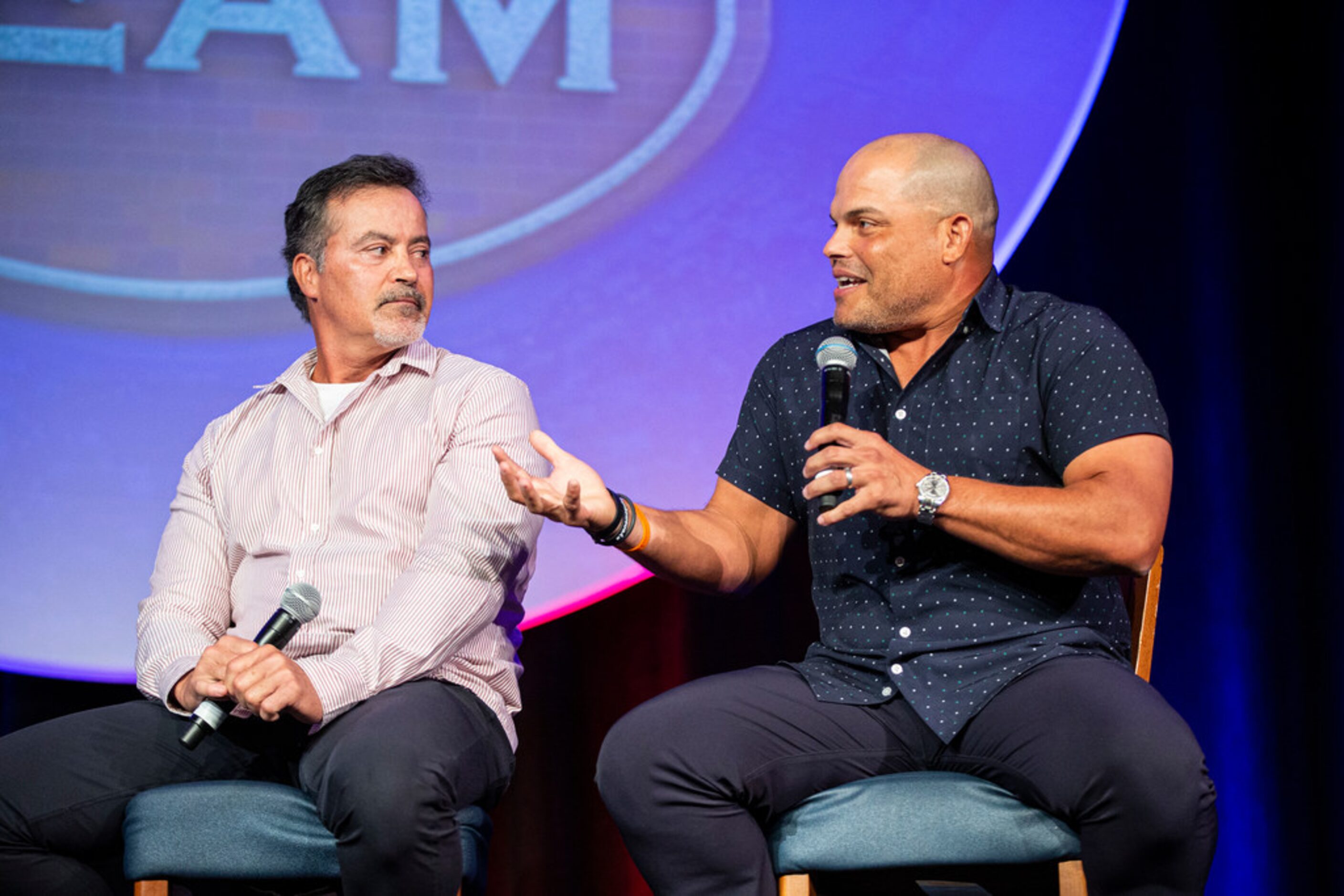 Former Texas RangersÃ Rafael Palmeiro, left, looks on as Ivan Rodriguez talks about his...